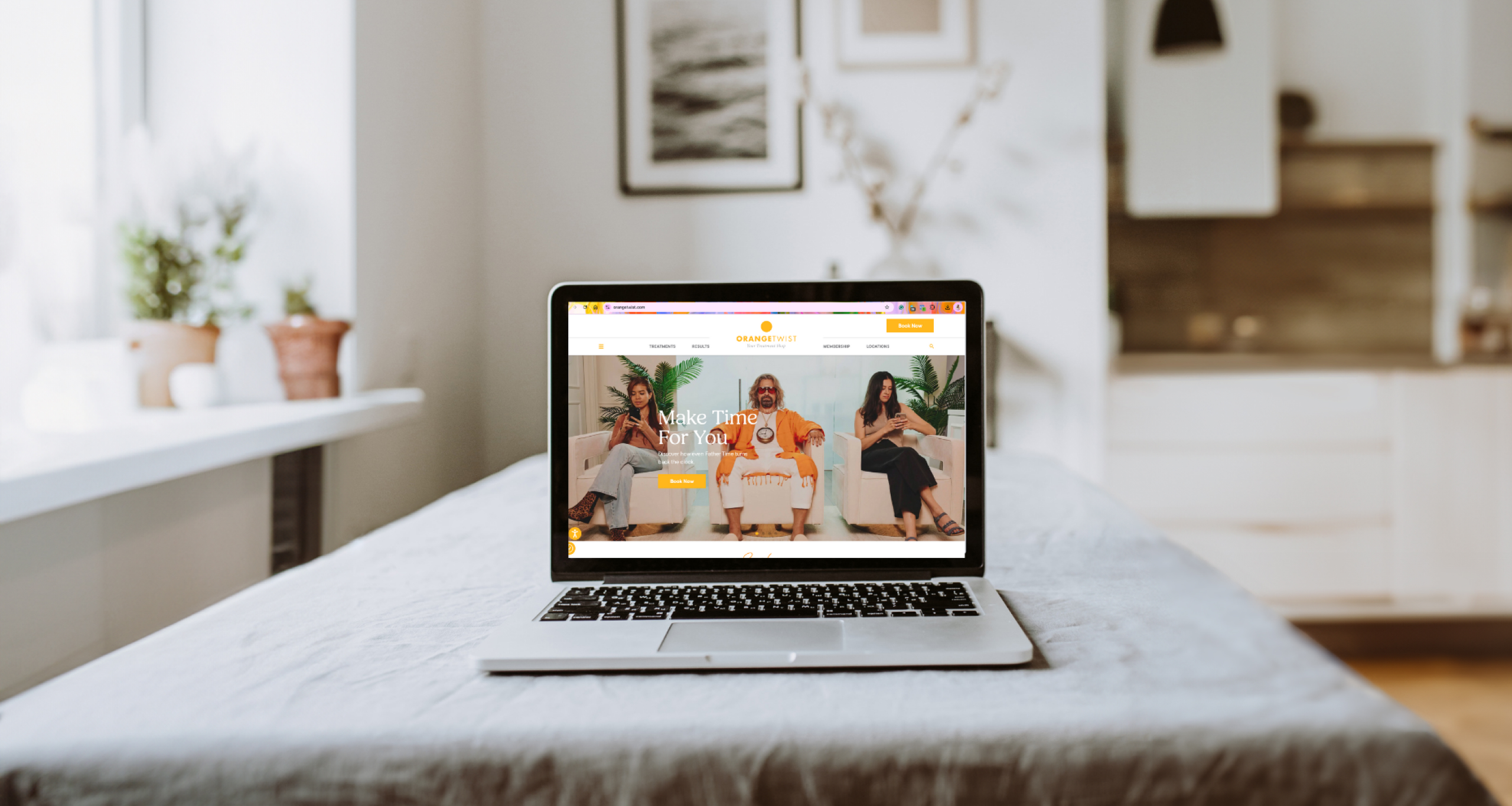 The Intersection of Wellness, Aesthetics, and Marketing 1 photo of laptop on a bed opened up to OrangeTwist's wellness campaign